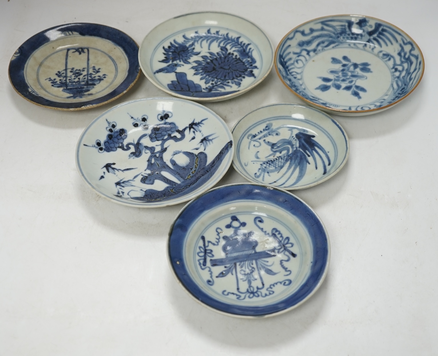 A group of 18th/19th century Chinese blue and white saucers and shallow dishes, largest 18cm in diameter. Condition - varies, mostly fair